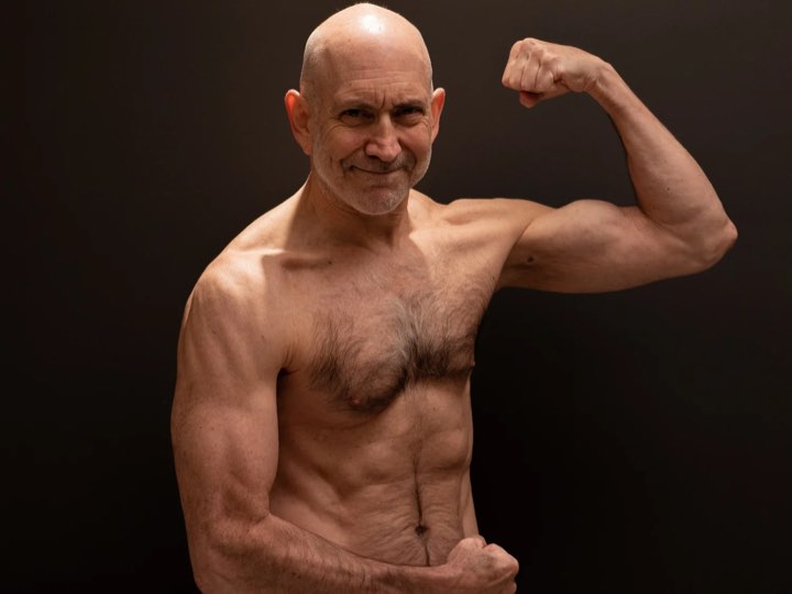 David Siegel, 66, lean and muscular, flexing