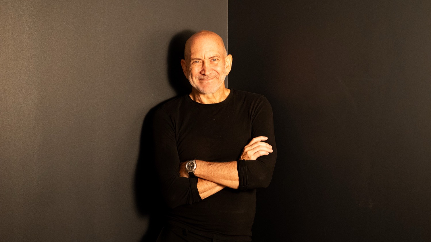 David Siegel, 66, arms folded, smiling